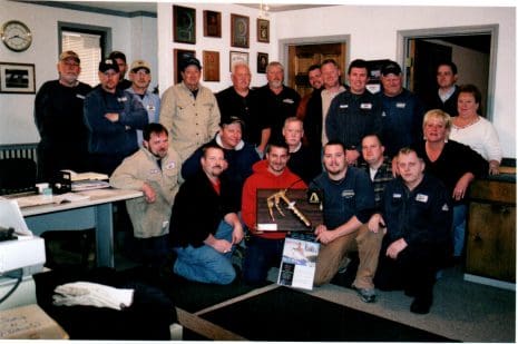 A group of men posing for a picture.
