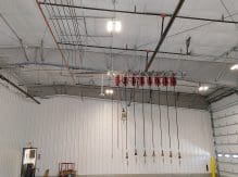 A room with many wires hanging from the ceiling.
