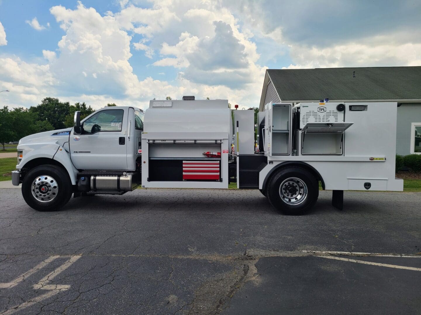 A white truck parked in the parking lot.
