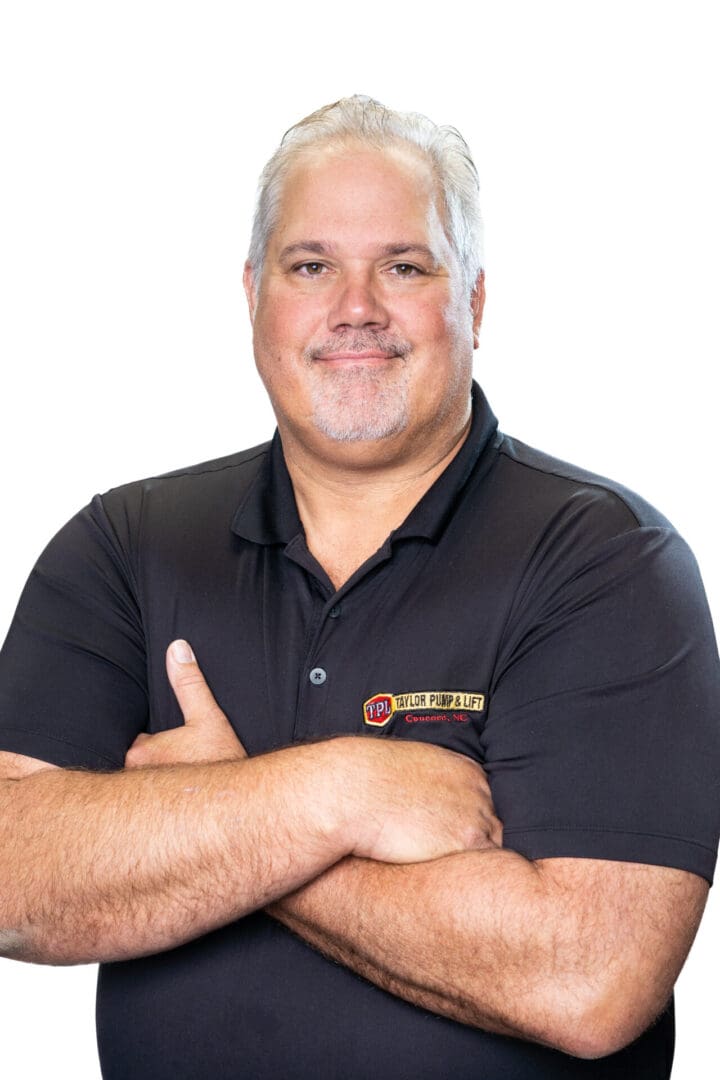 A man with his arms crossed wearing a black shirt.