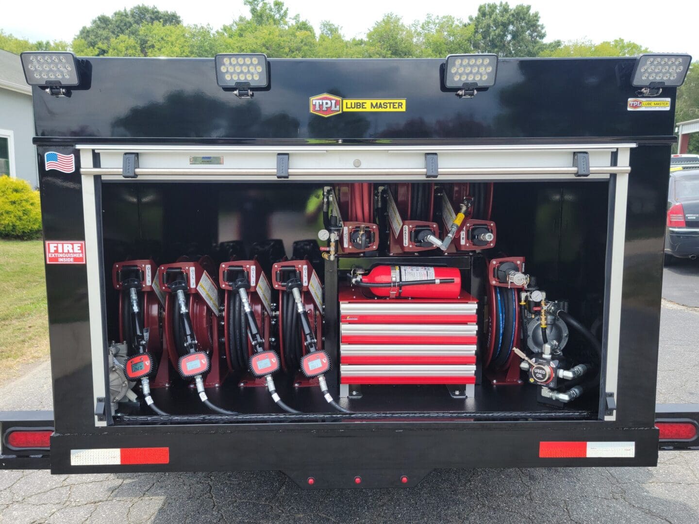 A truck with many tools in the back.