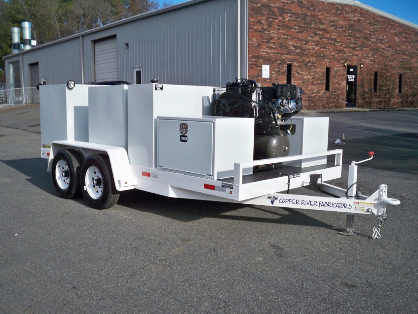A white trailer with two engines on it.